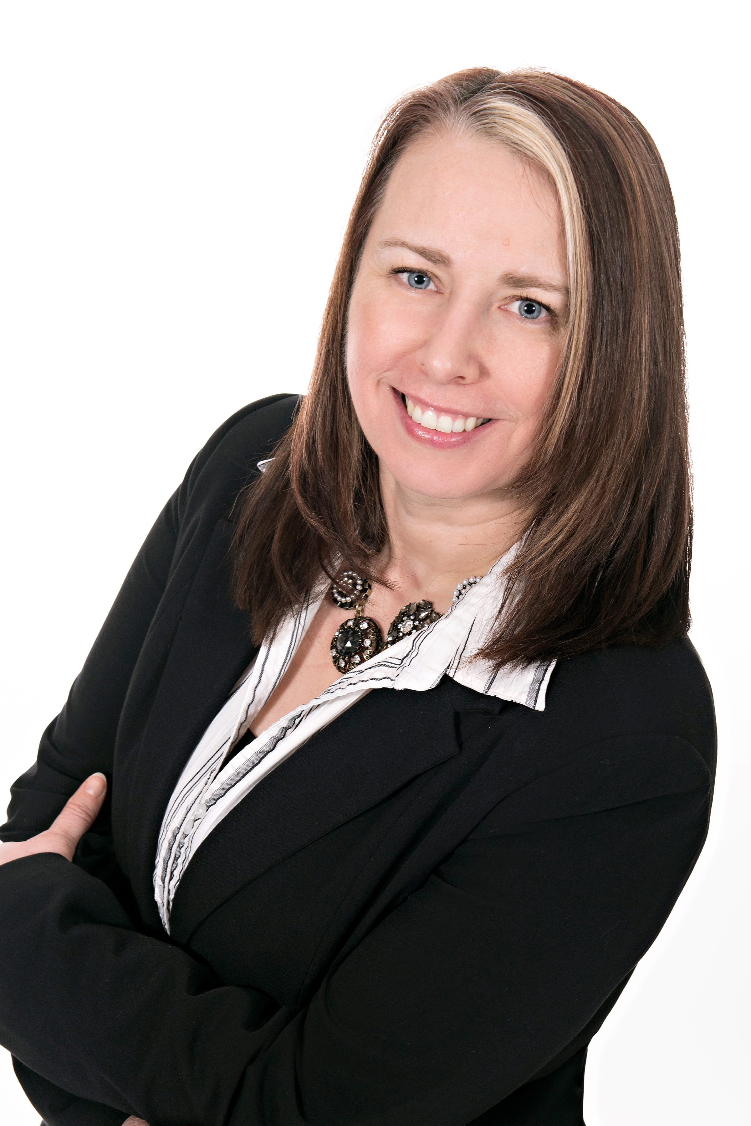 Faith Hakkarainen headshot. She is wearing a black business suit and smiling confidently.