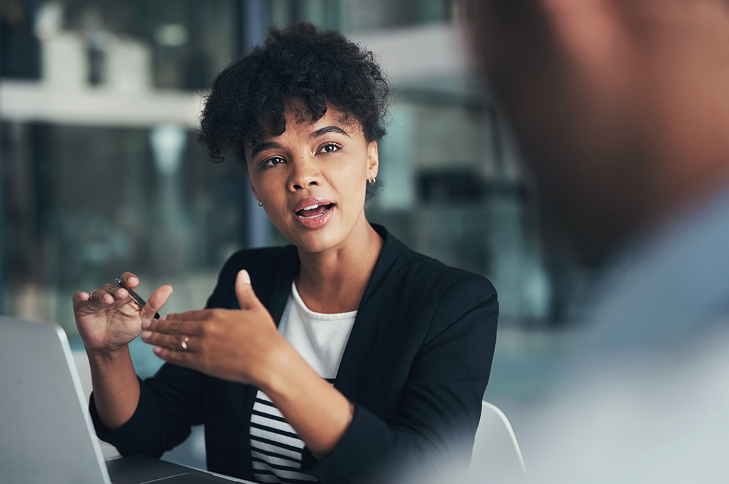 woman-talking-with-colleague-iStock-1460218853